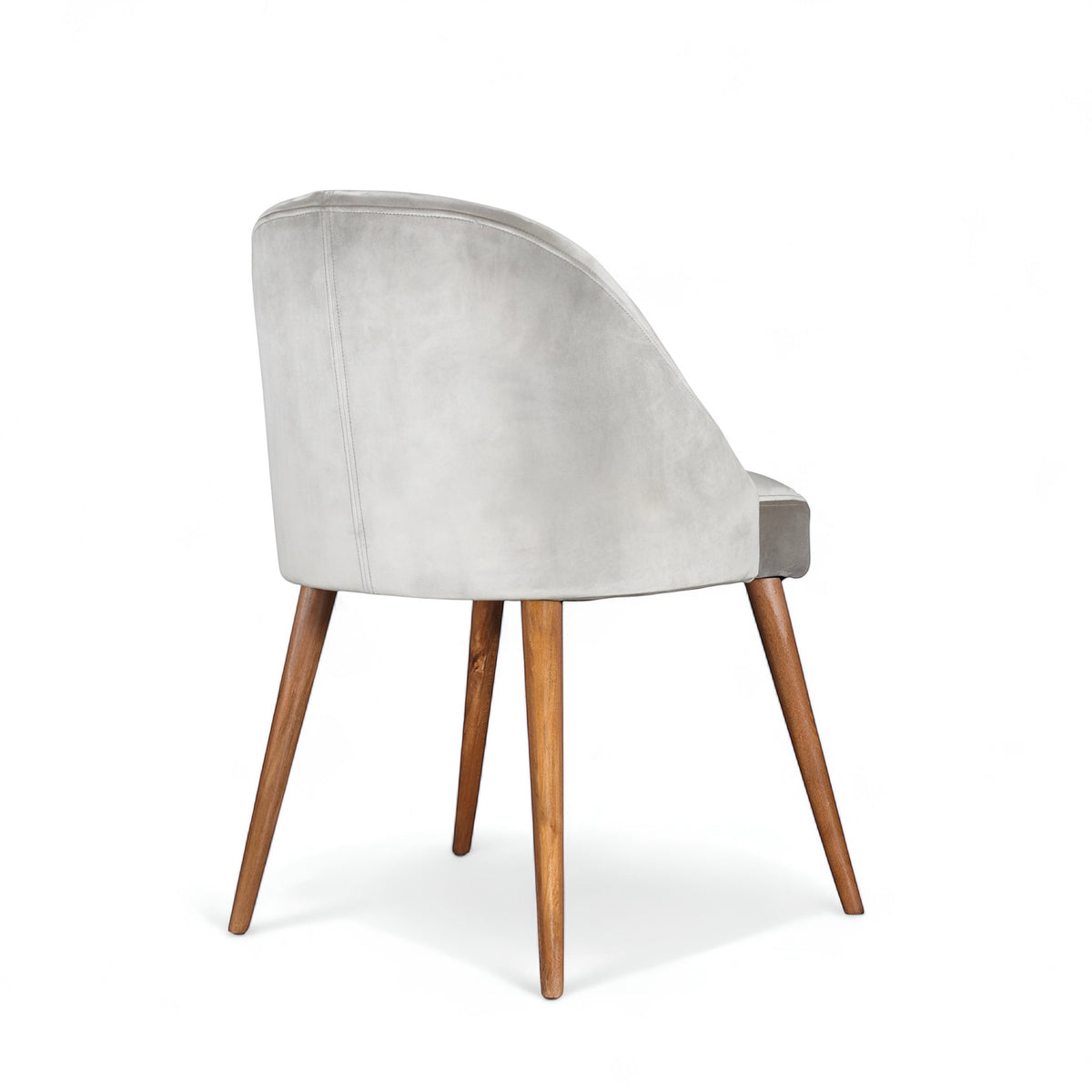 Rear angled view of the Vaya Home Alveare dining chair with gray upholstery and tapered wood legs.