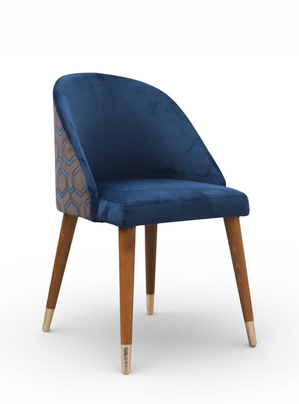 Front angled view of the Vaya Home Alveare dining chair with navy upholstery and tapered wood legs.