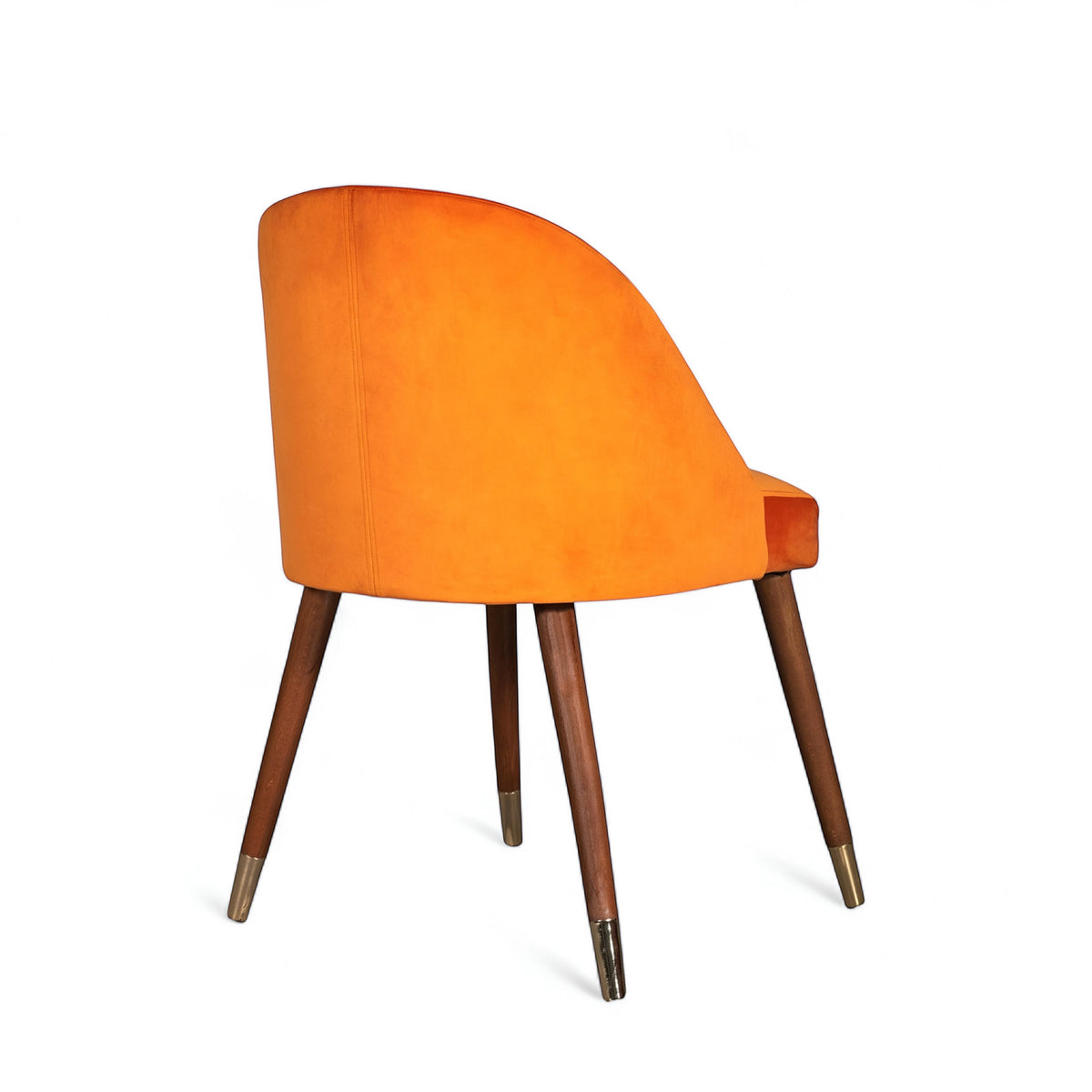 Rear angled view of the Vaya Home Alveare dining chair with orange upholstery and tapered wood legs.