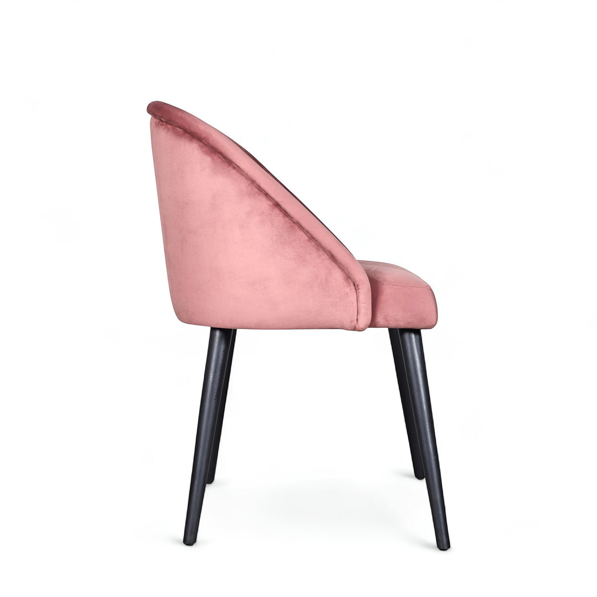 Side view of the Vaya Home Alveare dining chair with pink upholstery and black tapered legs.