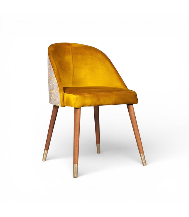 Front angled view of the Vaya Home Alveare dining chair with yellow upholstery and tapered wood legs.
