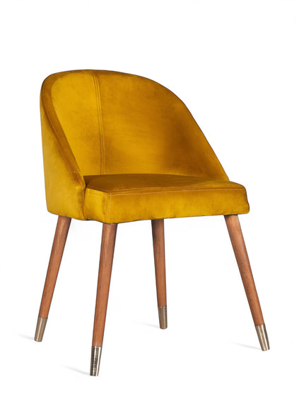 Front angled view of the Vaya Home Alveare dining chair with yellow upholstery and tapered wood legs.
