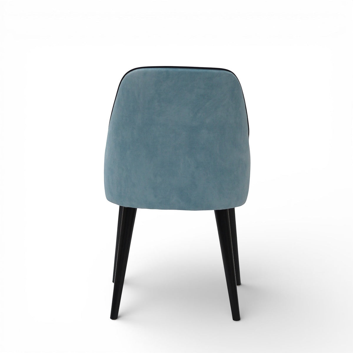 Back view of the Vaya Home Alven dining chair with a softly curved blue upholstered backrest and black legs.