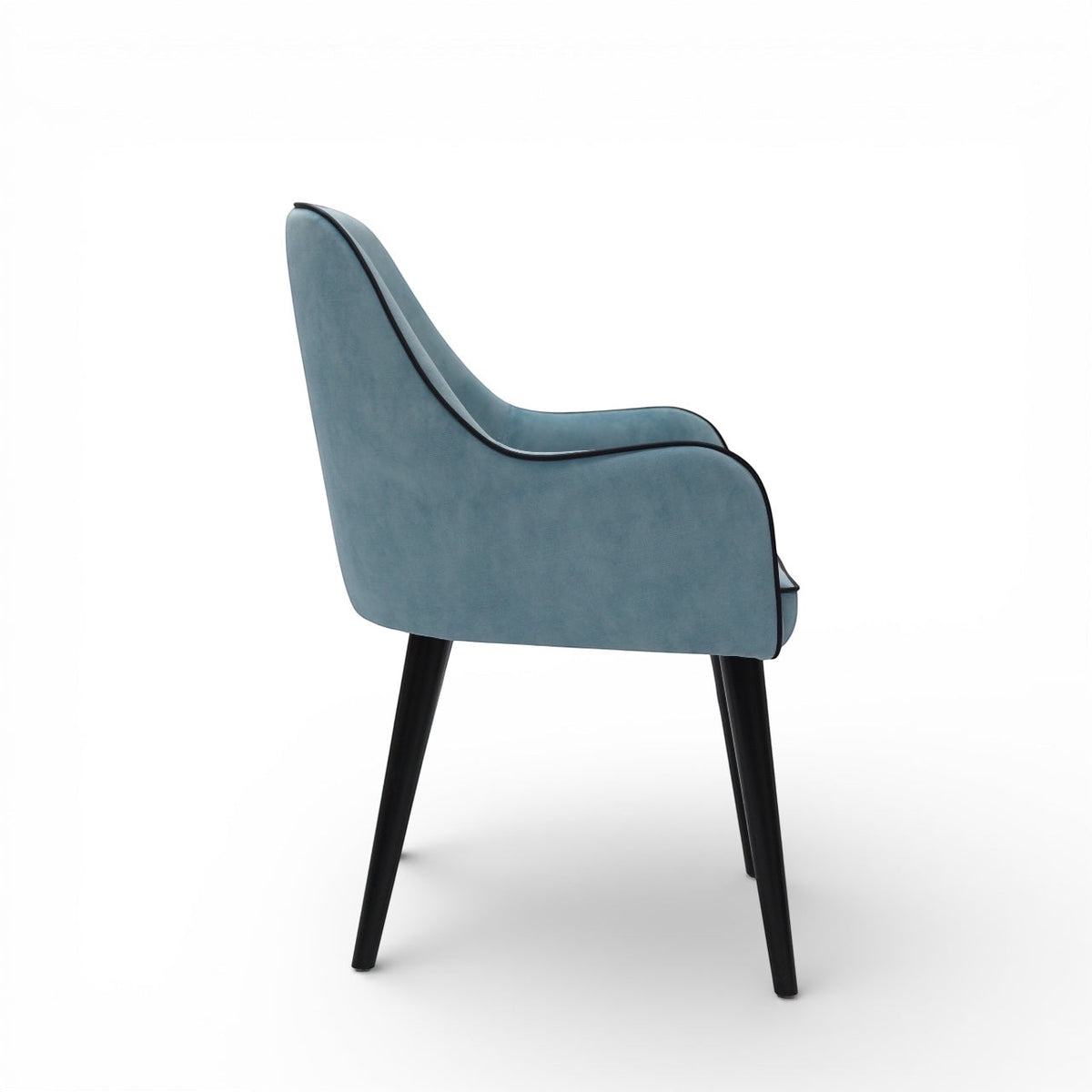Side view of the Vaya Home Alven dining chair showing blue upholstery, curved arm detail, and black tapered legs.