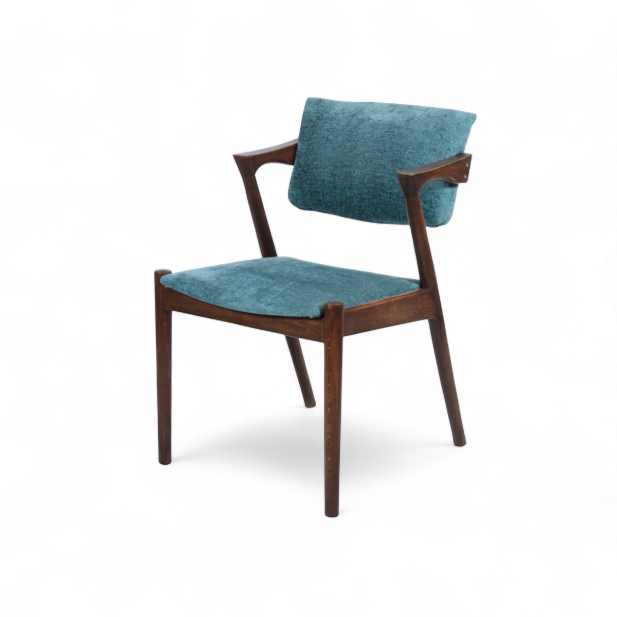 Front angled view of the Vaya Home Angolo dining chair with blue upholstery, angled wood arms, and a dark wood frame.