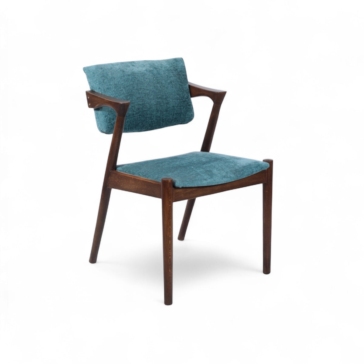 Front angled view of the Vaya Home Angolo dining chair with blue upholstery, angled wood arms, and a dark wood frame.