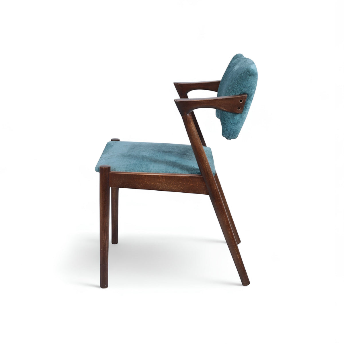 Product view of the Vaya Home Angolo dining chair in blue upholstery with angled wood arms and a dark wood frame.