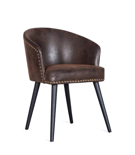 Front angled view of the Vaya Home Antigo dining chair with dark brown leather upholstery, nailhead trim, and black tapered legs.