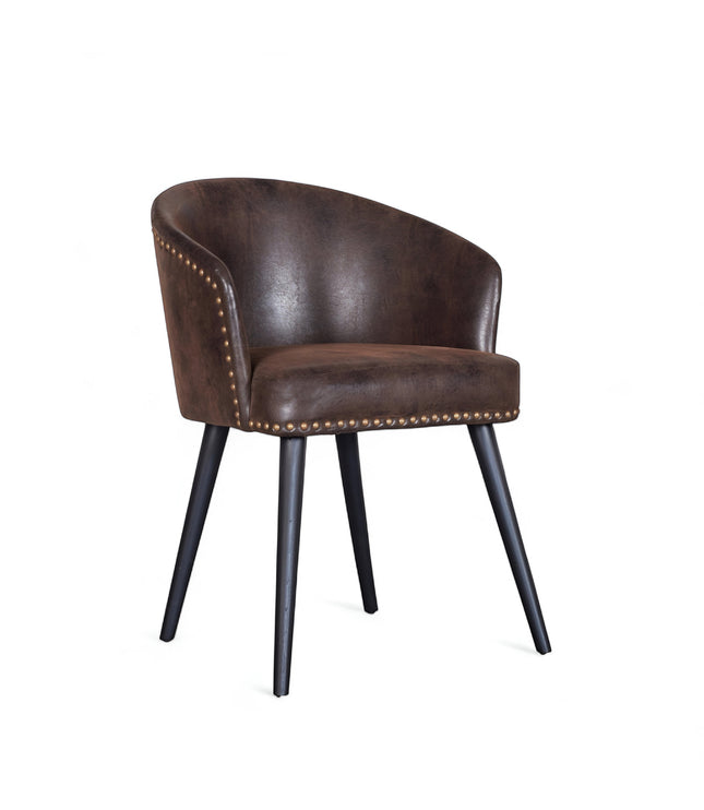 Front angled view of the Vaya Home Antigo dining chair with dark brown leather upholstery, nailhead trim, and black tapered legs.