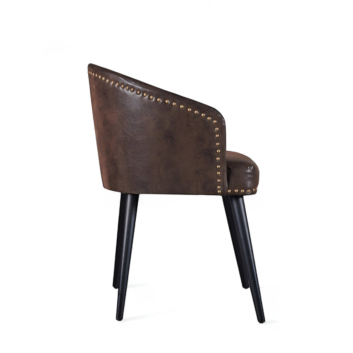 Side view of the Vaya Home Antigo dining chair featuring dark brown leather upholstery, curved barrel back, and black tapered legs.