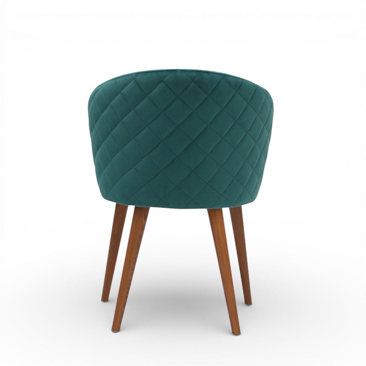 Back view of the Vaya Home Antigo dining chair featuring green velvet upholstery, diamond-quilted back detail, and tapered wood legs.