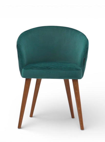 Front view of the Vaya Home Antigo dining chair with green velvet upholstery, rounded barrel back, and tapered wood legs.