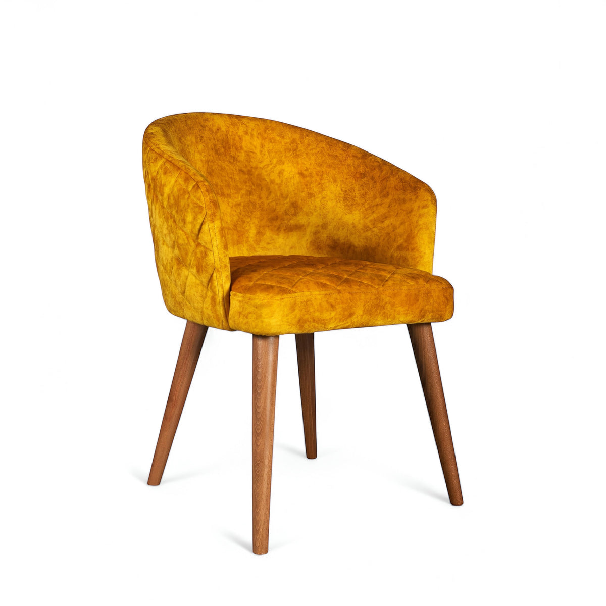 Front angled view of the Vaya Home Antigo dining chair with yellow velvet upholstery, curved barrel back, and tapered wood legs.