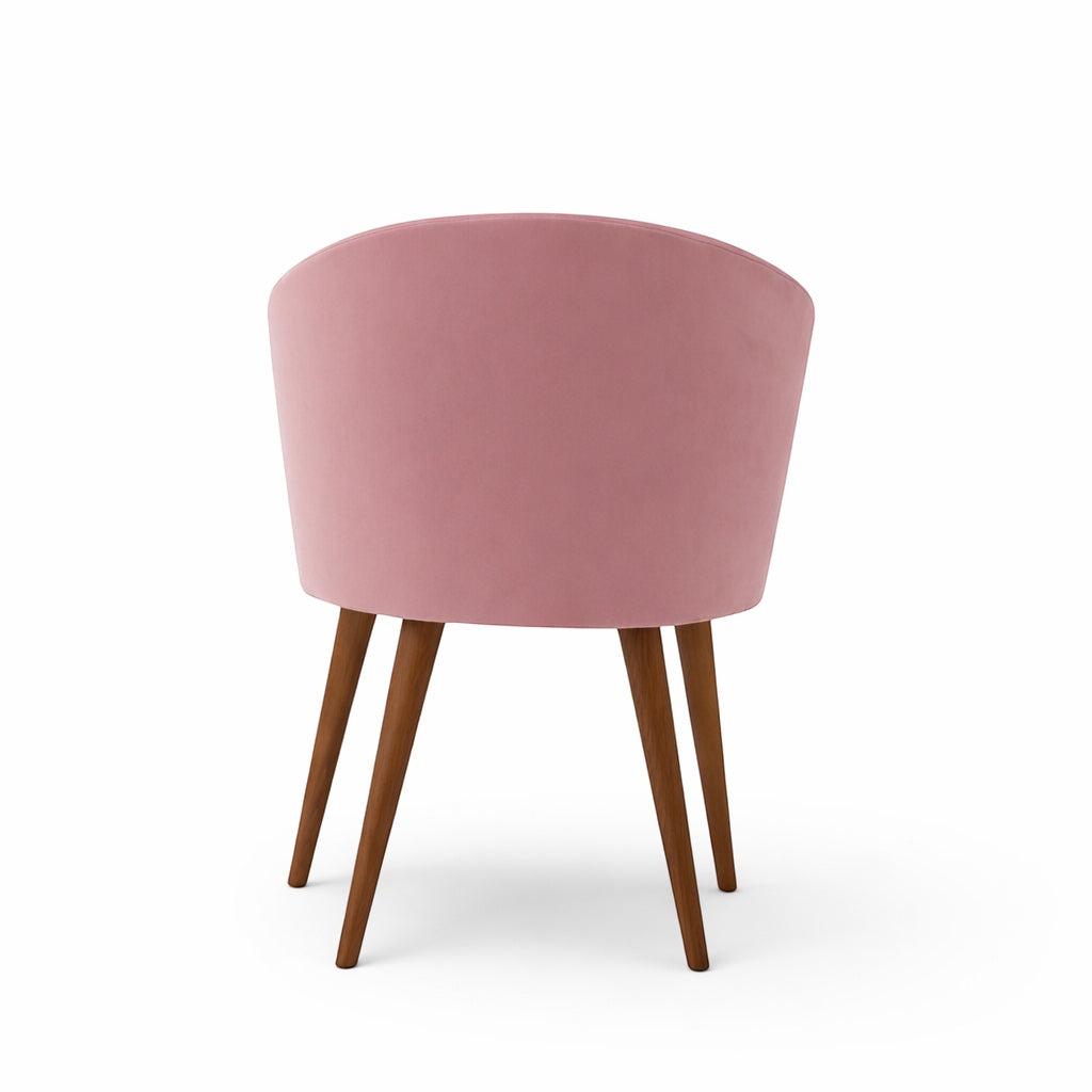 Back view of the Vaya Home Antigo pink accent chair with rounded upholstered backrest and tapered wood legs.