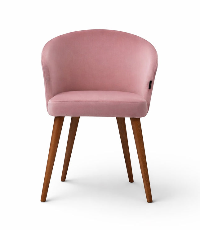 Front view of the Vaya Home Antigo pink accent chair with curved backrest, upholstered seat, and wood legs.
