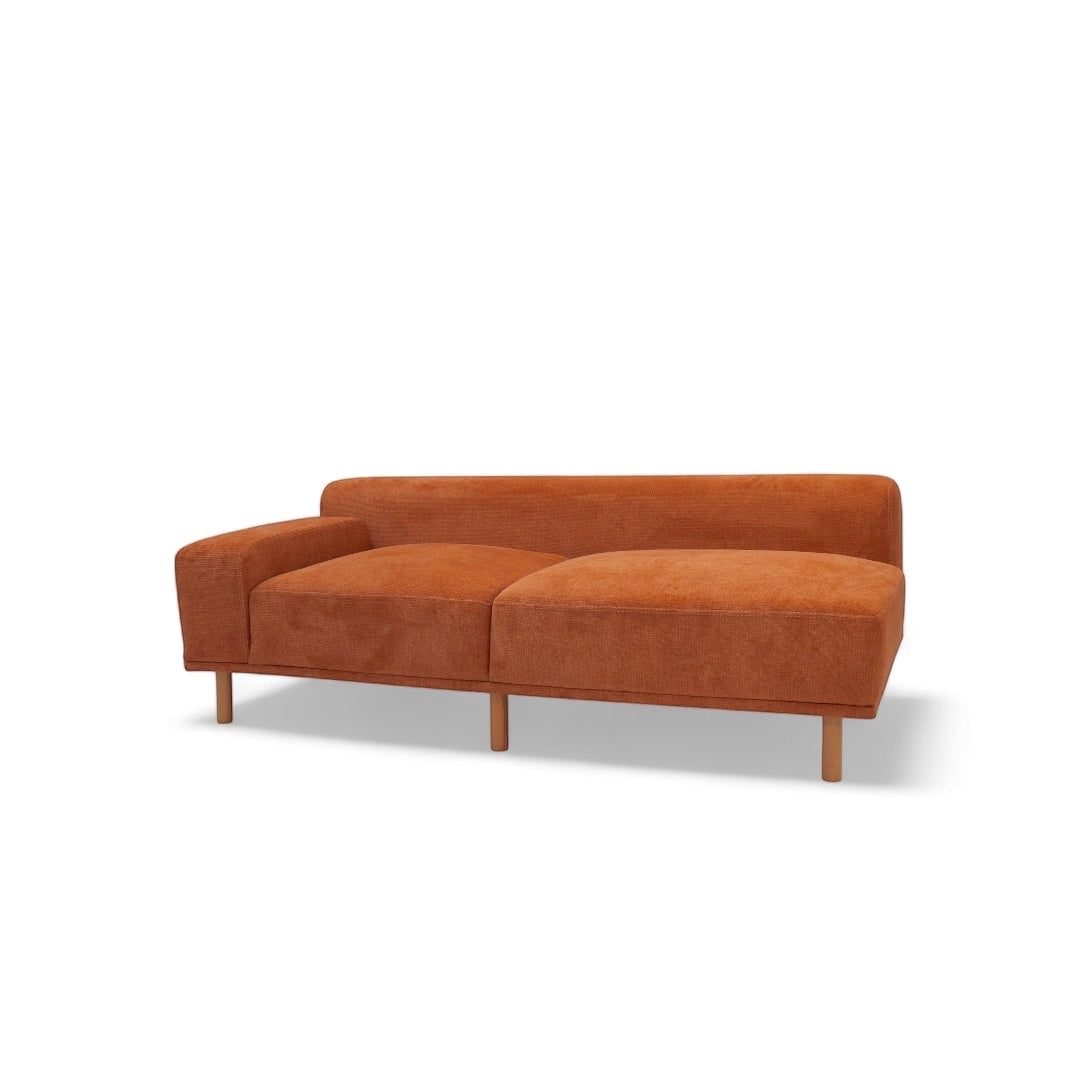 Vaya Home Arancio 2-seat module in rust orange upholstery with slim legs and a low-profile backrest.