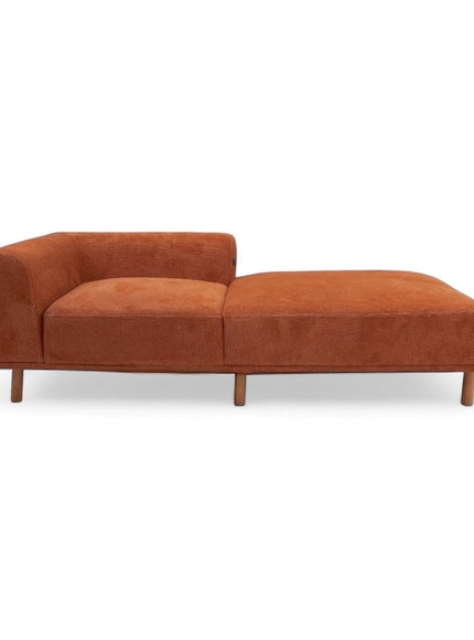 Front view of the Vaya Home Arancio lounge module in rust orange upholstery with chaise extension.