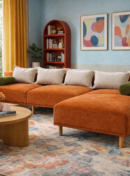 Vaya Home Arancio modular sofa in rust orange upholstery, styled in a colorful modern living room.