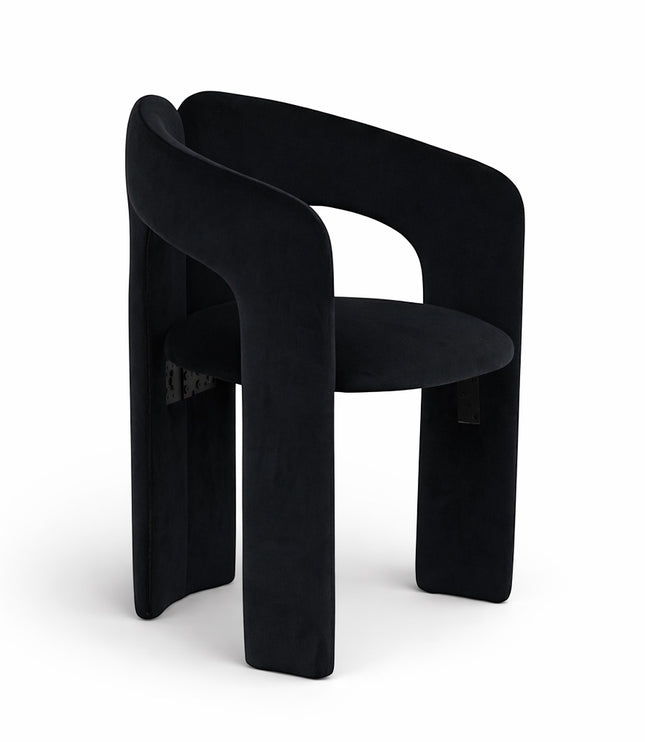 Angled front view of the Vaya Home Arcadia accent chair with black upholstery, curved arms, and an architectural silhouette.