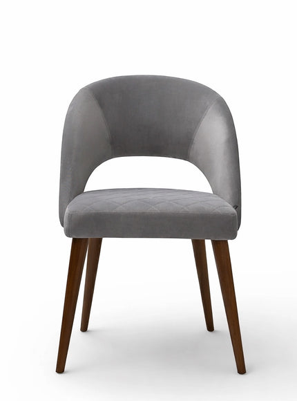 Front view of the Vaya Home Argent dining chair featuring grey upholstery, an open curved back, and tapered wood legs.
