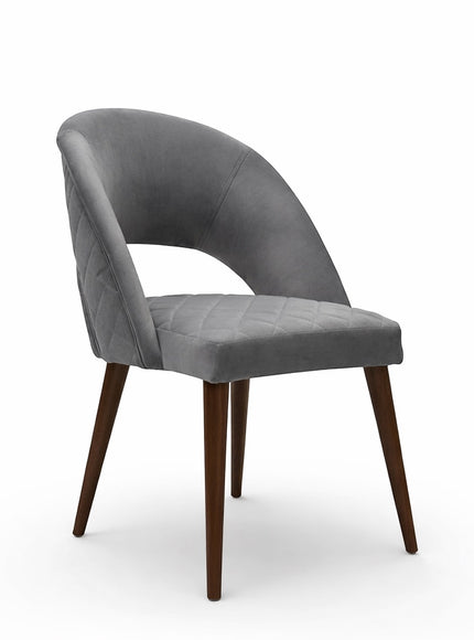 Vaya Home Argent dining chair with grey upholstery, open curved backrest, and tapered wood legs.