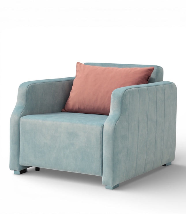 Front angled view of the Vaya Home Aristo sleeper chair with blue upholstery, wide arms, and a pink accent cushion.