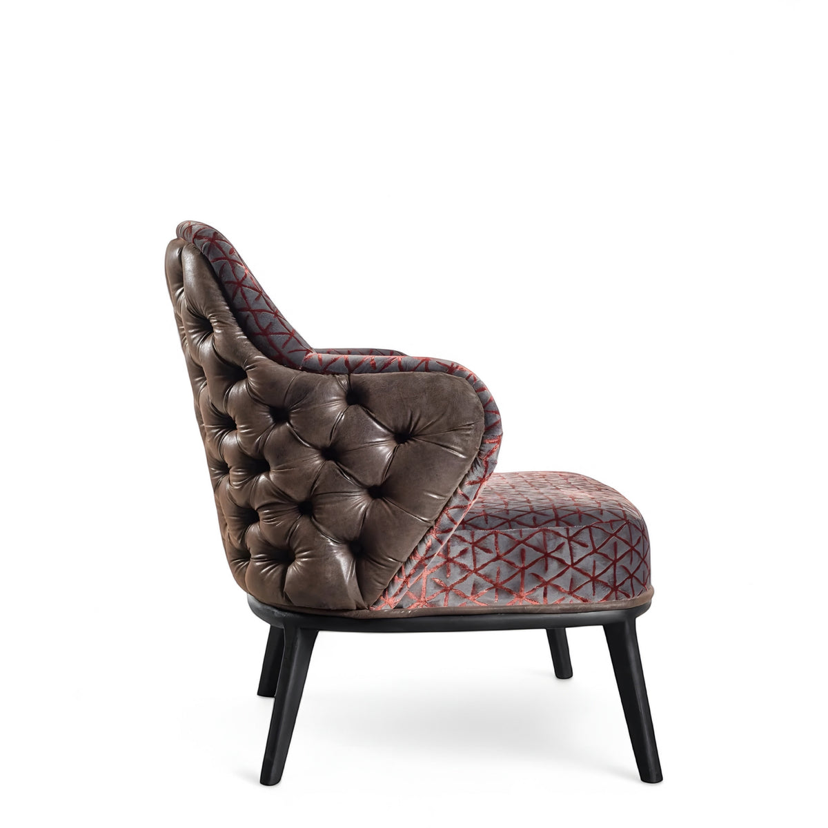 Side view of the Vaya Home Array accent chair showing tufted brown leather side panels, geometric patterned upholstery, and black legs.