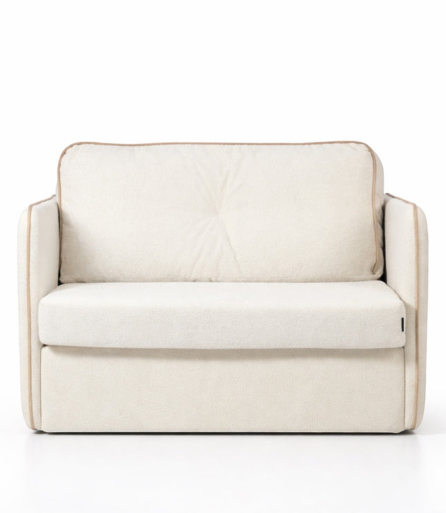 Front view of the Vaya Home Aureo sleeper chair with cream boucle upholstery, wide arms, and piped edge detailing.