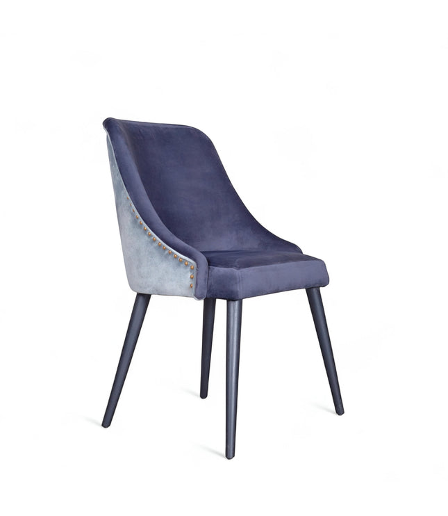 Front angled view of the Vaya Home Azzurro dining chair with dark blue upholstery, slim profile, and tapered dark legs.