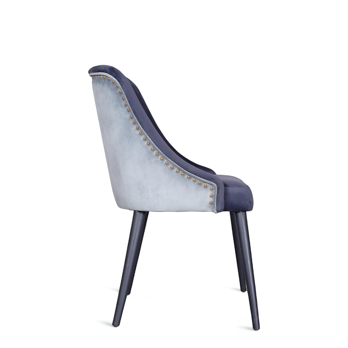 Rear angled view of the Vaya Home Azzurro dining chair featuring dark blue upholstery, contrast trim detail, and tapered dark legs.