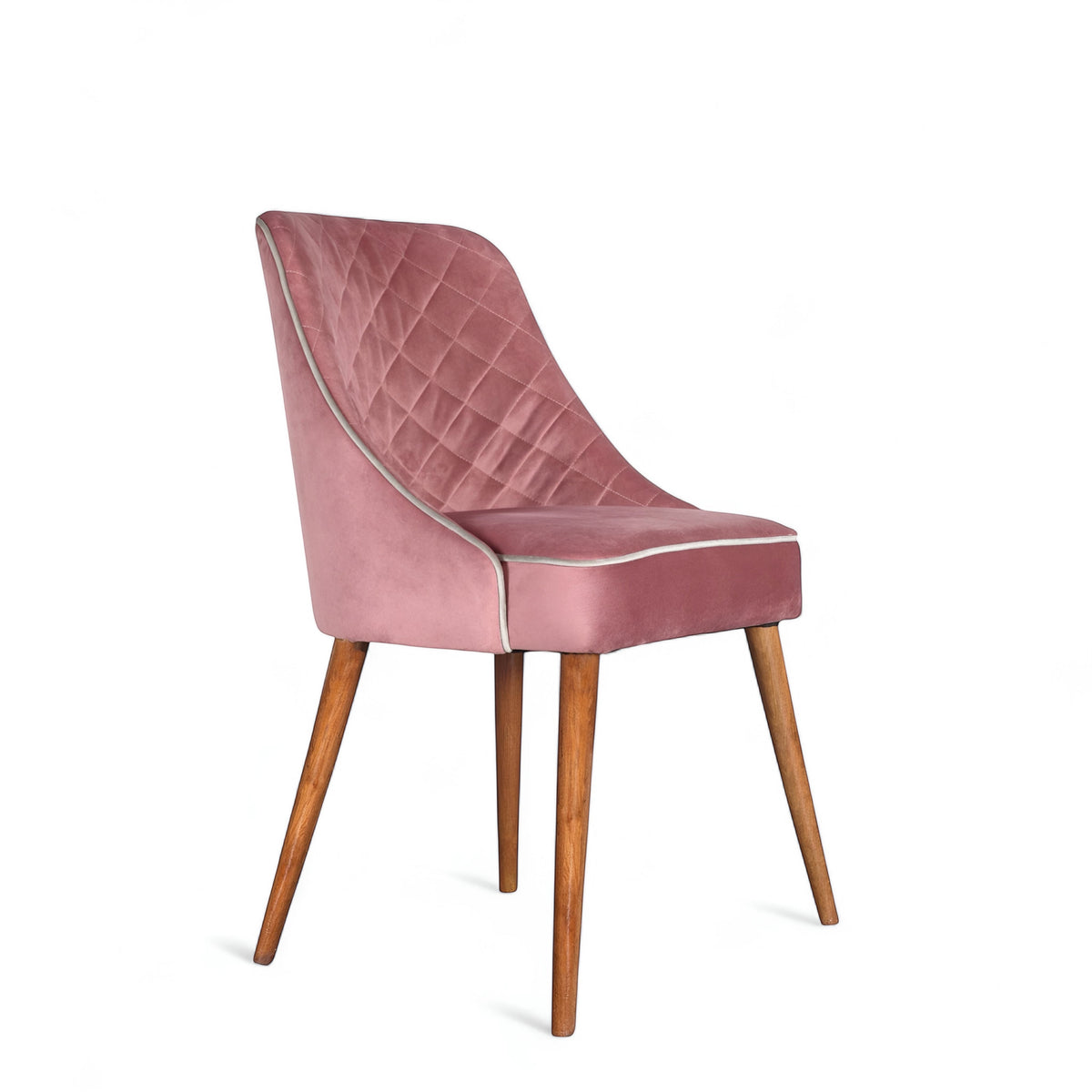 Front angled view of the Vaya Home Azzurro dining chair with pink upholstery, quilted back detail, and tapered wood legs.