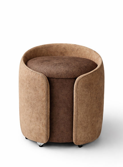 Vaya Home Barrel round storage ottoman in two-tone brown upholstery with cushioned seat.