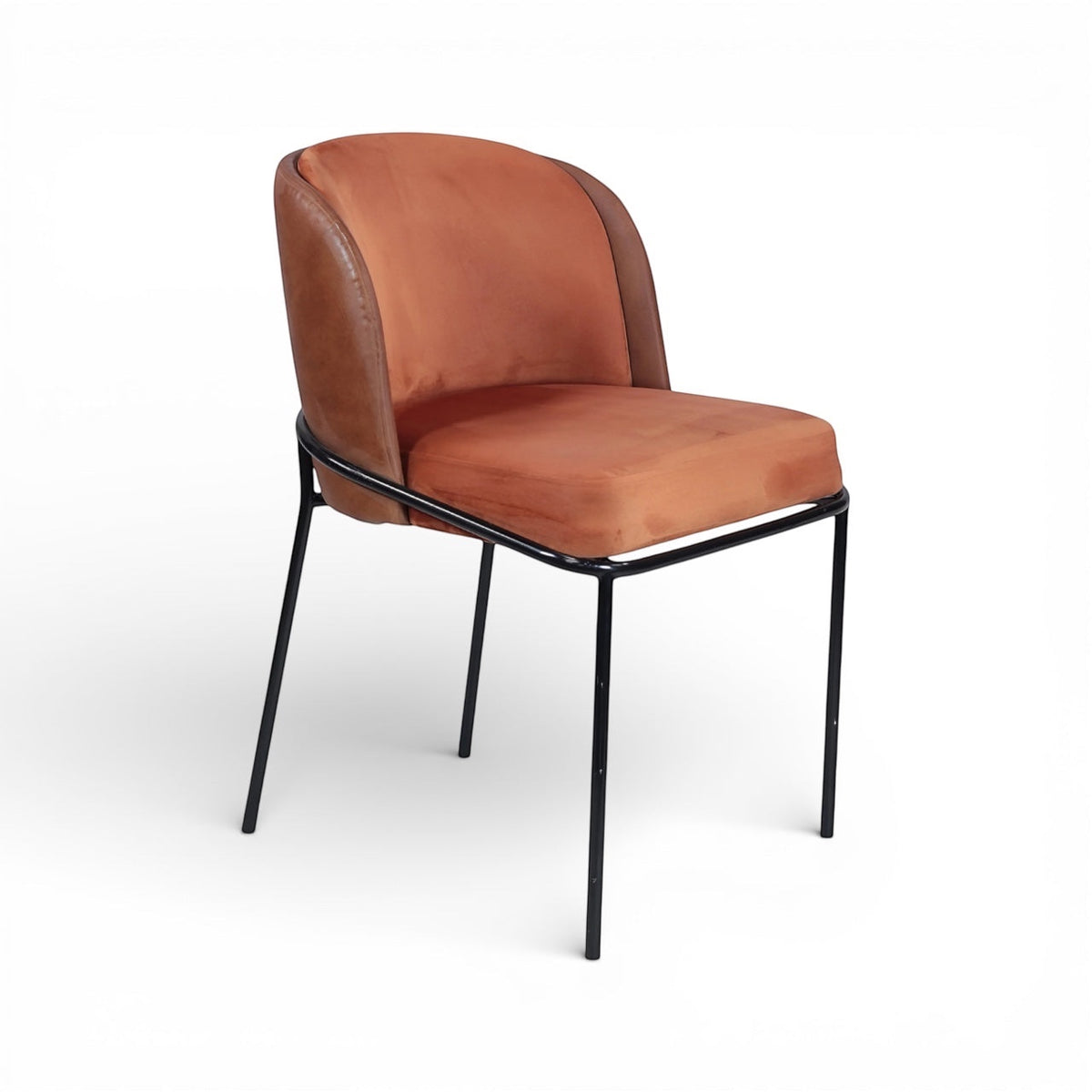 Front angled view of the Vaya Home Batata dining chair with warm brown upholstery, curved backrest, and slim black metal legs.