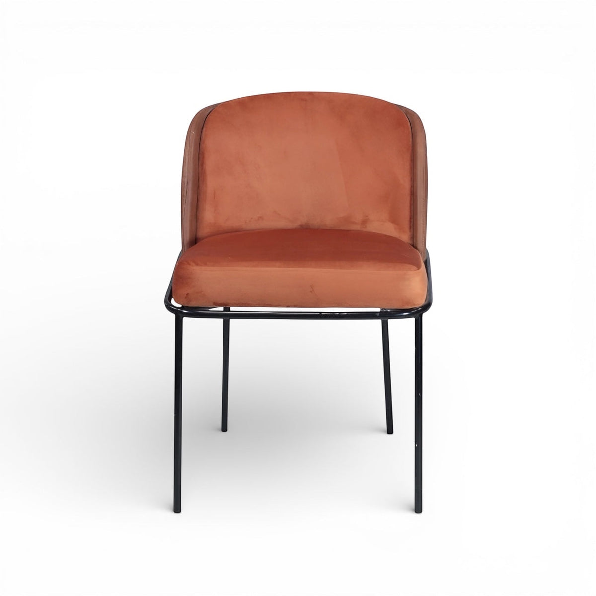 Front view of the Vaya Home Batata dining chair featuring brown upholstery, rounded backrest, and slim black metal legs.