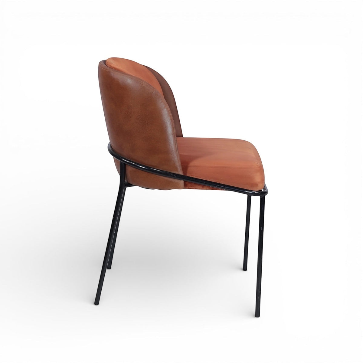 Side view of the Vaya Home Batata dining chair featuring brown upholstery, a curved backrest, and slim black metal legs.