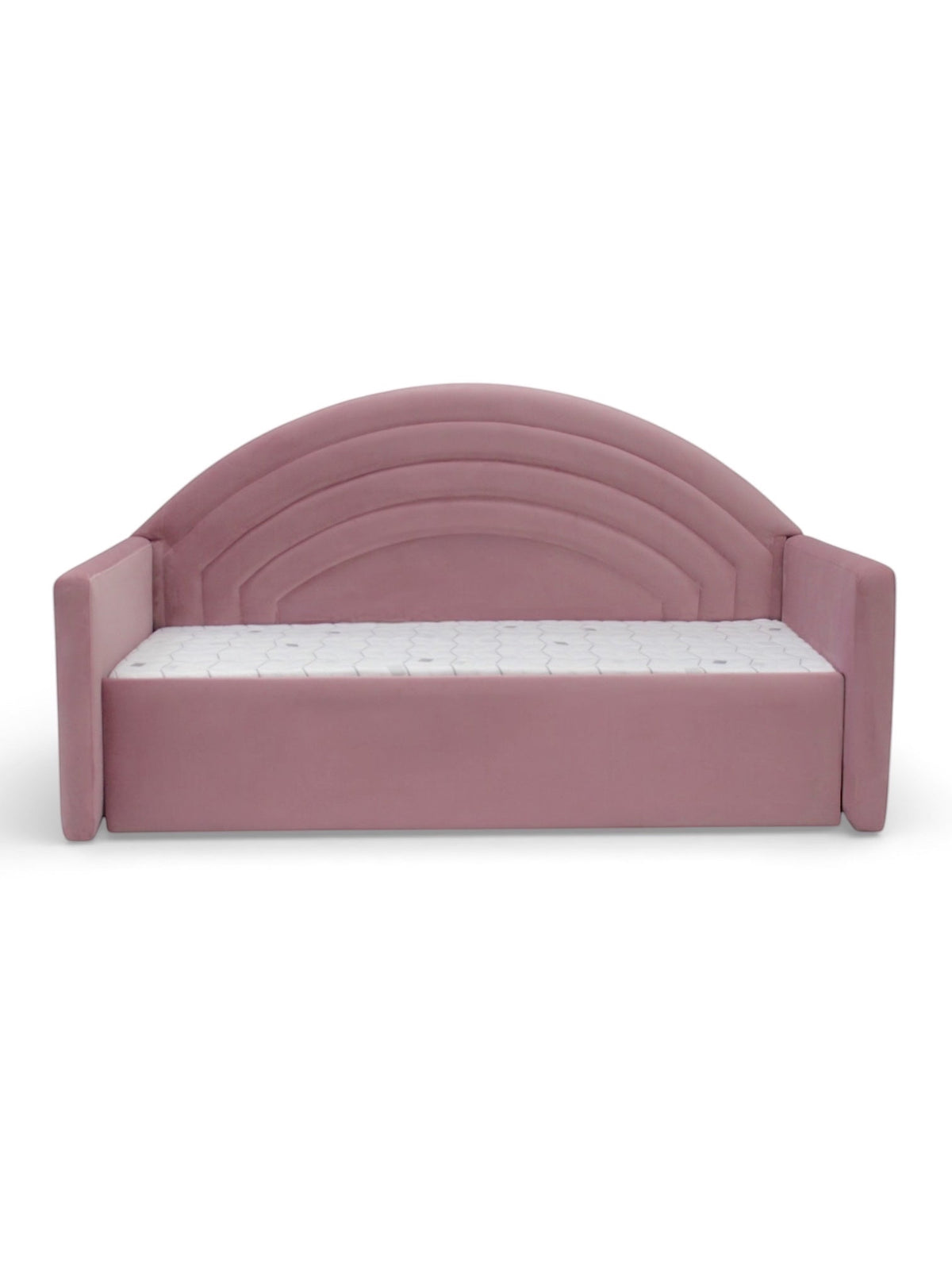 Angled view of the Vaya Home Bed Rainbow pink kids bed featuring upholstered side rails and an arched rainbow-style headboard.