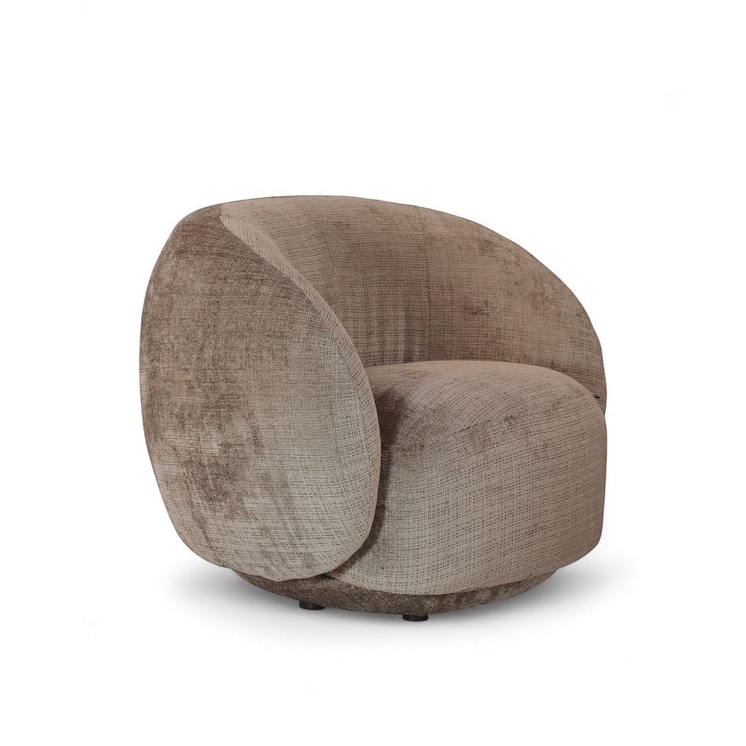 Angled view of the Vaya Home Beige Cloud accent chair with rounded silhouette and beige textured upholstery.