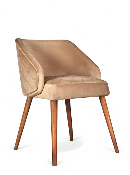 Front angled view of the Vaya Home Biscotta dining chair with beige upholstery, curved arm detail, and tapered wood legs.