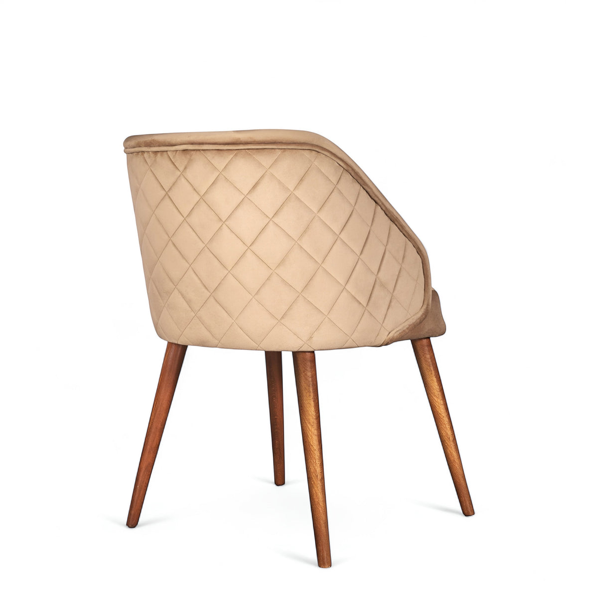 Rear angled view of the Vaya Home Biscotta dining chair featuring beige upholstery, diamond-quilted back detail, and tapered wood legs.