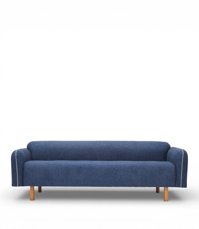 Front view of the Vaya Home Blaire sofa with blue upholstery, slim track arms, and wood legs.