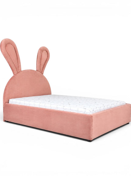 Front angled view of the Vaya Home Bunny kids bed featuring pink upholstery, a rounded headboard, and bunny ear detailing.