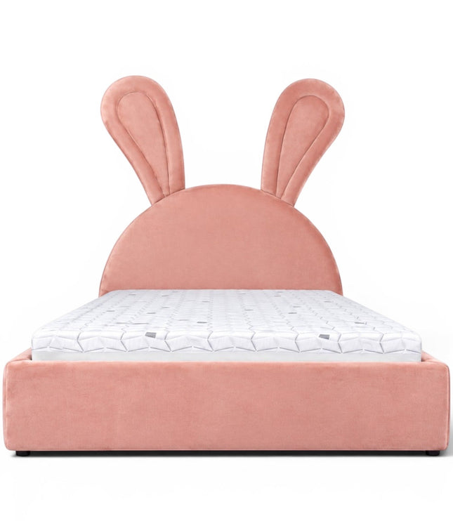Front view of the Vaya Home Bunny kids bed with pink upholstery, a rounded headboard, and oversized bunny ear detailing.