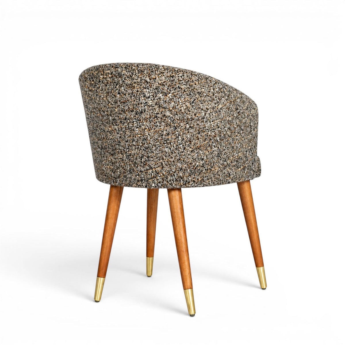 Back view of the Vaya Home Cambria accent chair with multitone textured upholstery, a rounded barrel back, and tapered wood legs with gold caps.