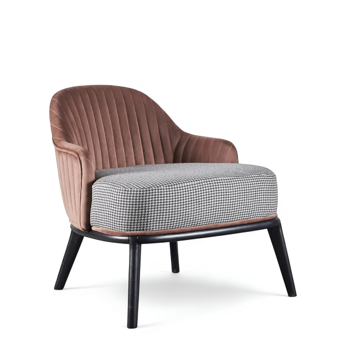 Front angled view of the Vaya Home Carruba accent chair with curved arms, a rose gold channel-tufted back, gray upholstered seat, and black legs.