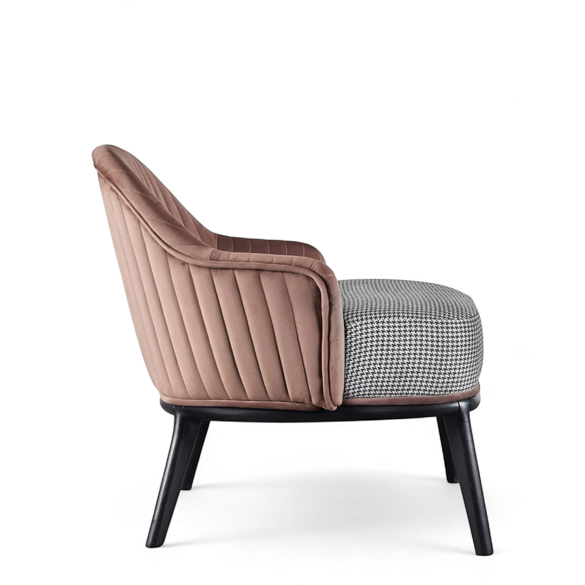 Side view of the Vaya Home Carruba accent chair featuring a rose gold channel-tufted back, gray upholstered seat, and black legs.