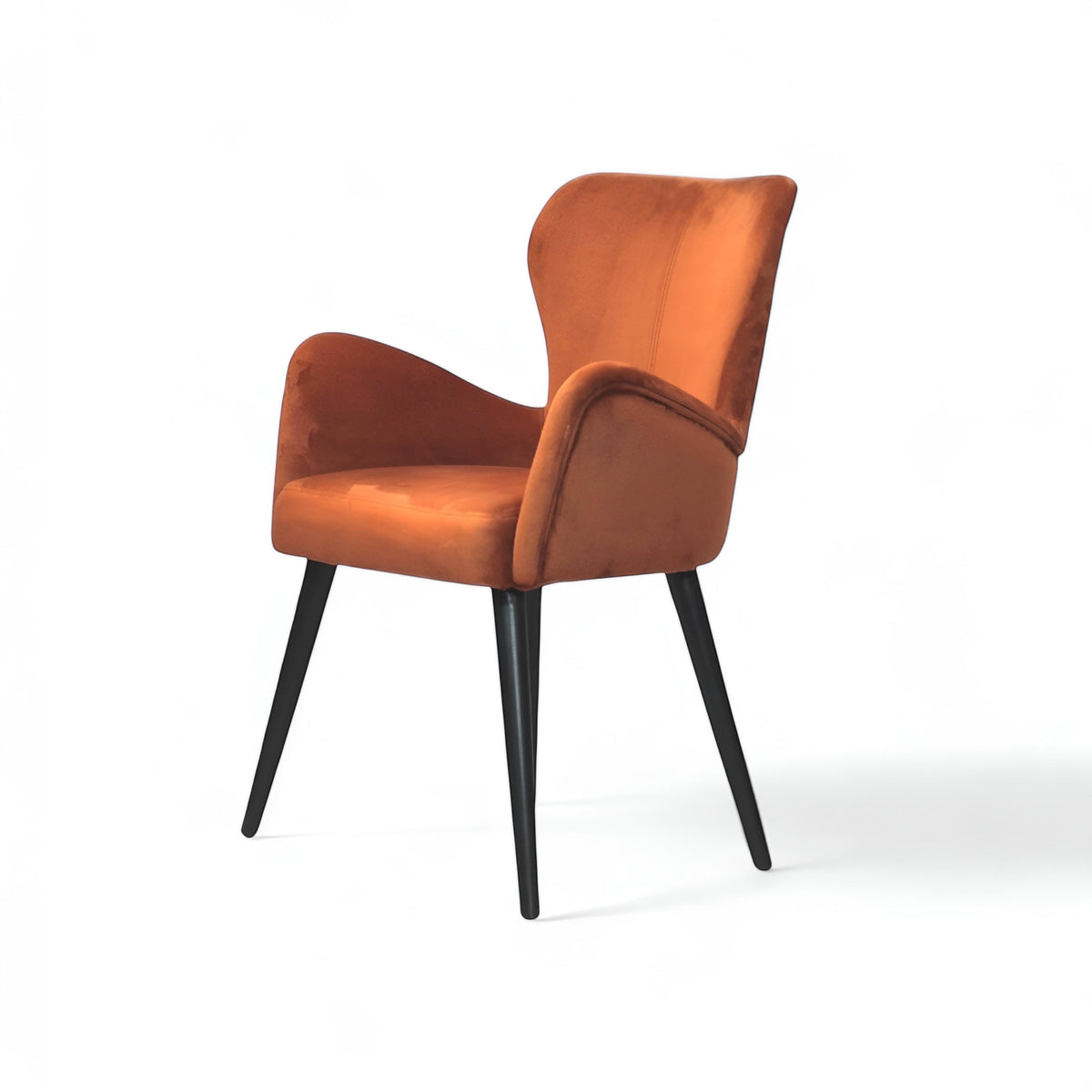 Front angled view of the Vaya Home Celebrity accent chair with orange upholstery, sculpted arms, and black tapered legs.