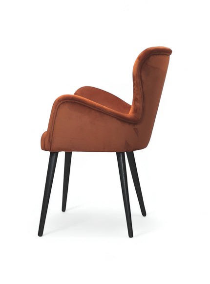 Opposite side view of the Vaya Home Celebrity accent chair featuring orange upholstery, sculpted arms, and black tapered legs.