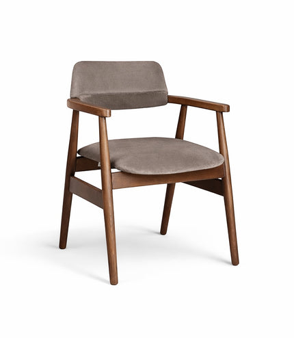Front angled view of the Vaya Home Chairo dining chair with taupe upholstery, curved seat and backrest, and a warm wood frame.