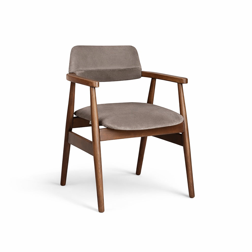 Front angled view of the Vaya Home Chairo dining chair with taupe upholstery, curved seat and backrest, and a warm wood frame.