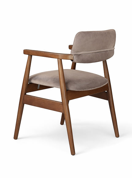 Rear angled view of the Vaya Home Chairo dining chair featuring taupe upholstery, open arm design, and a warm wood frame.